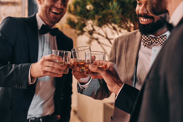 close-up-of-three-well-dressed-men-drinking-whiske-2022-12-16-13-40-20-utc
