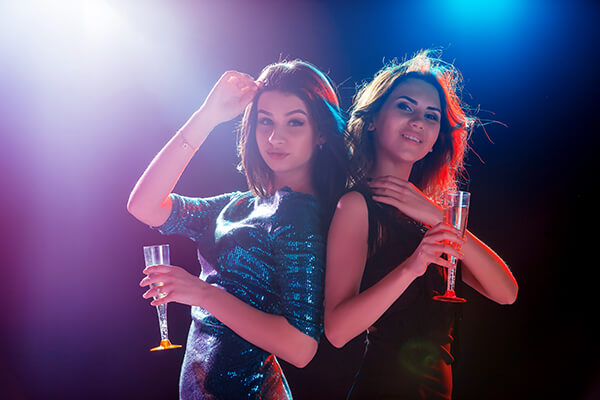 two-beautiful-girls-dancing-at-the-party-drinking